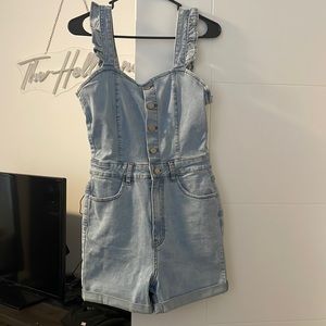 Francesca’s Denim Romper with ruffle shoulder Strap